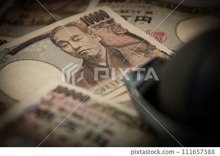 grenade placed on money 111657388