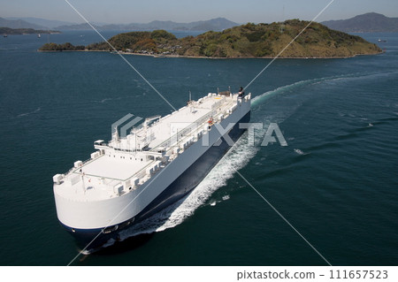 Car carrier passing through Kurushima Kaikyo Bridge 111657523