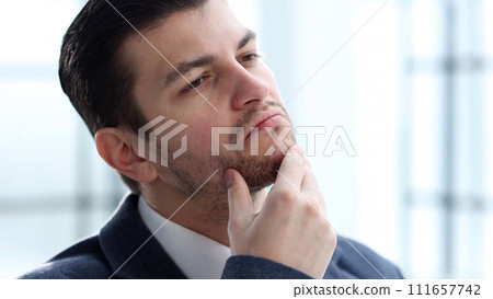 A businessman man working in the office in close-up A businessman man working in the office in close-up 111657742