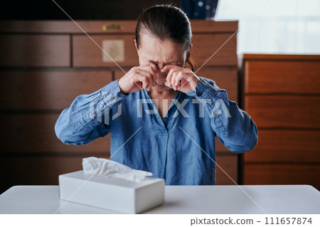 Senior woman in her 60s with itchy eyes Senior woman in her 60s with itchy eyes 111657874
