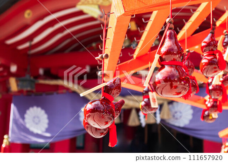 A gourd filled with wishes hung at a shrine 111657920