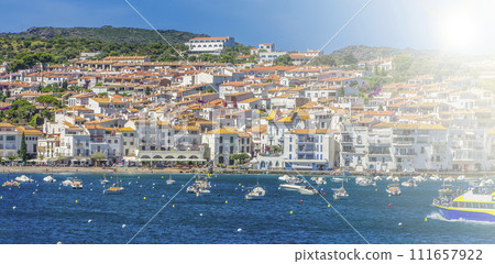 Famous village of Cadaques in sunny day on sunlight. Costa Brava. Famous village of Cadaques in sunny day on sunlight. Costa Brava. 111657922