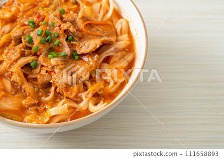 Korean udon ramen noodles with pork in kimchi soup Korean udon ramen noodles with pork in kimchi soup 111658893