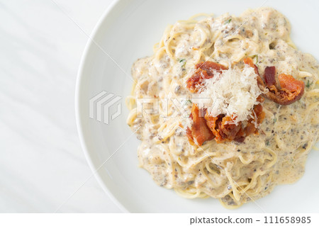 spaghetti with truffle cream sauce and mushroom spaghetti with truffle cream sauce and mushroom 111658985