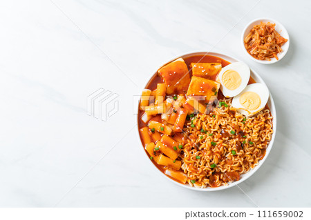 Korean instant noodles with Korean rice cake and fish cake and boiled egg Korean instant noodles with Korean rice cake and fish cake and boiled egg 111659002