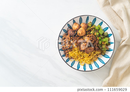 dried egg noodle with pork and meatball 111659029