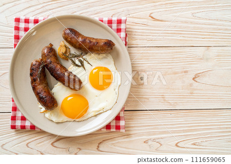 double fried egg with pork sausage double fried egg with pork sausage 111659065