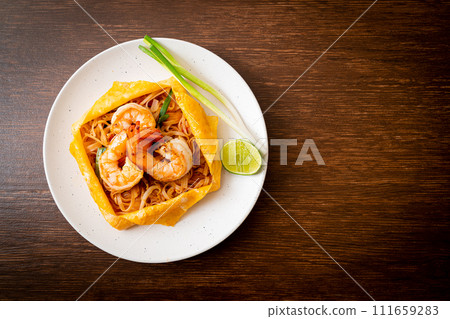 Thai stir fried noodles with shrimps and egg wrap (Pad Thai) Thai stir fried noodles with shrimps and egg wrap (Pad Thai) 111659283
