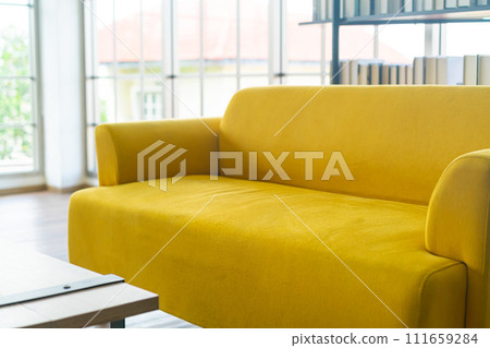 empty yellow sofa decoration in a room empty yellow sofa decoration in a room 111659284