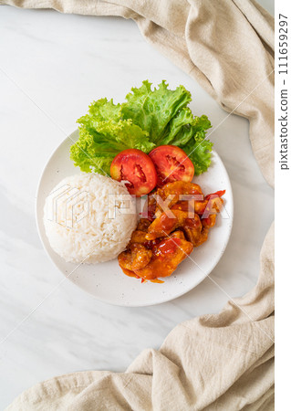 Fried fish topped by 3 flavors chili sauce with rice Fried fish topped by 3 flavors chili sauce with rice 111659297