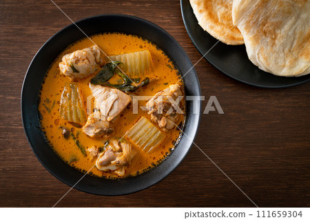Chicken curry soup with roti Chicken curry soup with roti 111659304