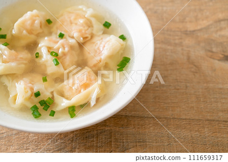 shrimp dumpling soup in white bowl 111659317
