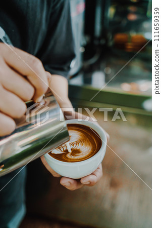 pouring milk for making latte art coffee pouring milk for making latte art coffee 111659359