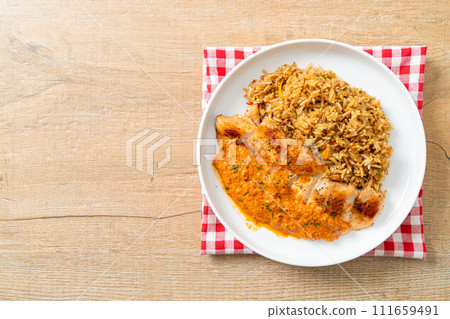 grilled chicken steak with red curry sauce and rice 111659491