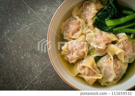 pork wonton soup or pork dumplings soup with vegetable 111659532
