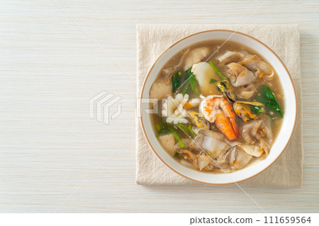 Wide Rice Noodles with Seafood in Gravy Sauce Wide Rice Noodles with Seafood in Gravy Sauce 111659564