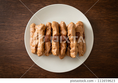 chocolate meringue stick on plate 111659623