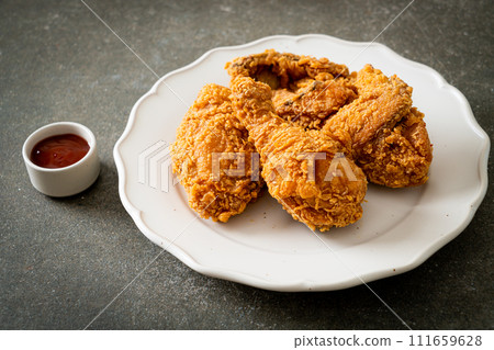 fried chicken with ketchup on plate fried chicken with ketchup on plate 111659628