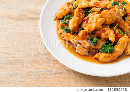 stir-fried fried fish with basil and chili in thai style 111659658