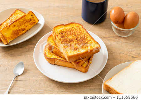 french toast on white plate 111659660