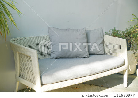 comfortable pillows on wicker chair comfortable pillows on wicker chair 111659977