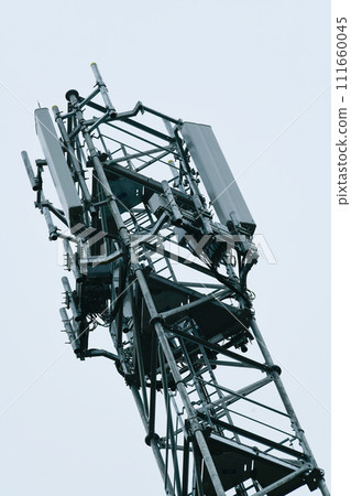 Deployment of the 5G network. Laying antennas on a mobile phone mast in the winter atmosphere 111660045