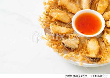 deep fried Enoki mushroom and King Oyster mushroom with spicy dipping sauce 111660312