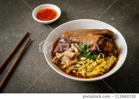 egg noodles with stewed and braised duck in brown soup egg noodles with stewed and braised duck in brown soup 111660330