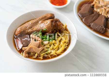 egg noodles with stewed and braised duck in brown soup egg noodles with stewed and braised duck in brown soup 111660338