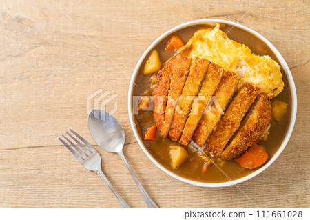 curry rice with fried pork cutlet and creamy omelet curry rice with fried pork cutlet and creamy omelet 111661028