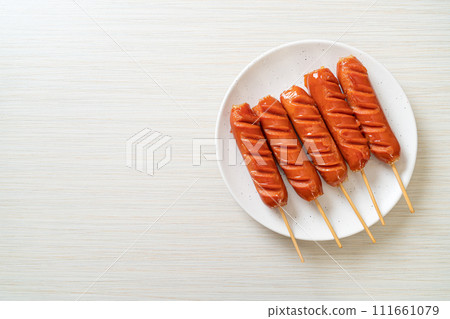 fried sausage skewer on plate fried sausage skewer on plate 111661079