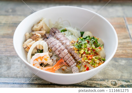 spicy seafood noodles bowl in Thai style 111661275