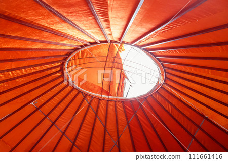 round hole in a traditional Kazakh or Kyrgyz yurt house inside, aul. smoke outlet round hole in a traditional Kazakh or Kyrgyz yurt house inside, aul. smoke outlet 111661416
