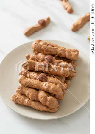 chocolate meringue stick on plate chocolate meringue stick on plate 111661656