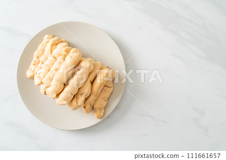 almonds meringue stick on plate 111661657