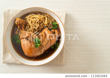 Noodles with Braised Chicken in Brown Soup 111661664