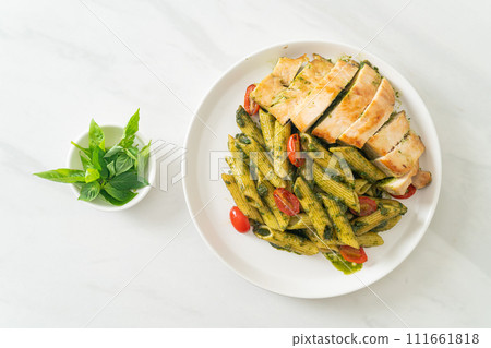 penne pasta in pesto sauce with grilled chicken 111661818