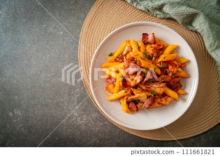 stir-fried penne pasta with kimchi and bacon 111661821