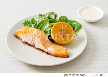 fried salmon steak with lemon and vegetable fried salmon steak with lemon and vegetable 111661855