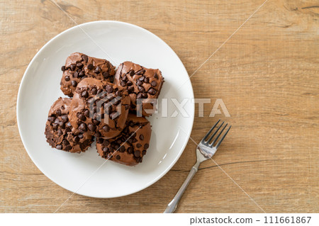 dark chocolate brownies topped by chocolate chips dark chocolate brownies topped by chocolate chips 111661867