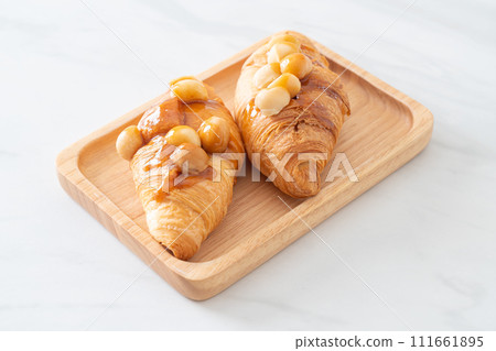 croissant with macadamia and caramel 111661895