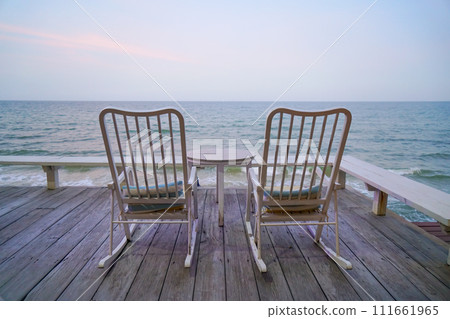 empty chair on balcony with sea background 111661965
