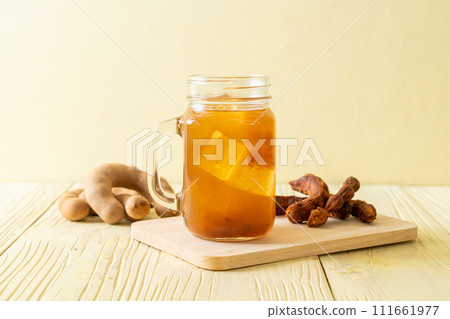 Delicious sweet drink tamarind juice and ice cube 111661977