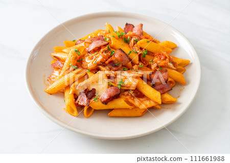stir-fried penne pasta with kimchi and bacon stir-fried penne pasta with kimchi and bacon 111661988