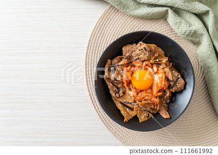pork bulgogi rice bowl with kimchi and Korean pickled egg 111661992