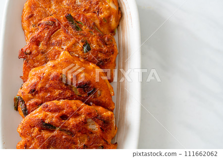 Korean Kimchi pancake or Kimchijeon - Fried Mixed Egg, Kimchi, and Flour Korean Kimchi pancake or Kimchijeon - Fried Mixed Egg, Kimchi, and Flour 111662062