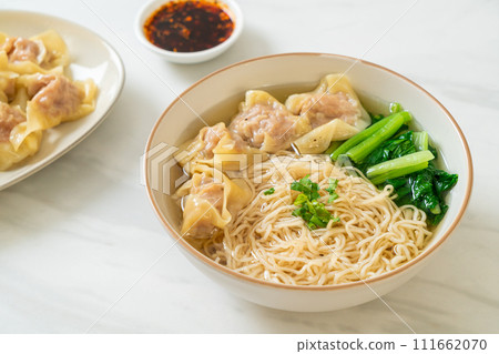 egg noodles with pork wonton soup or pork dumplings soup and vegetable 111662070