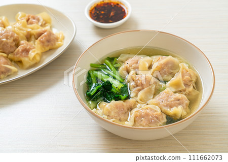 pork wonton soup or pork dumplings soup with vegetable 111662073