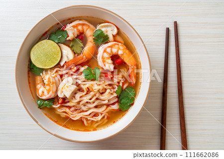 instant noodles ramen in spicy soup with shrimps (Tom Yum Kung) instant noodles ramen in spicy soup with shrimps (Tom Yum Kung) 111662086