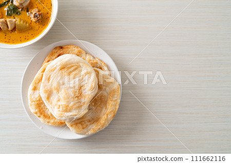 Chicken curry soup with roti 111662116